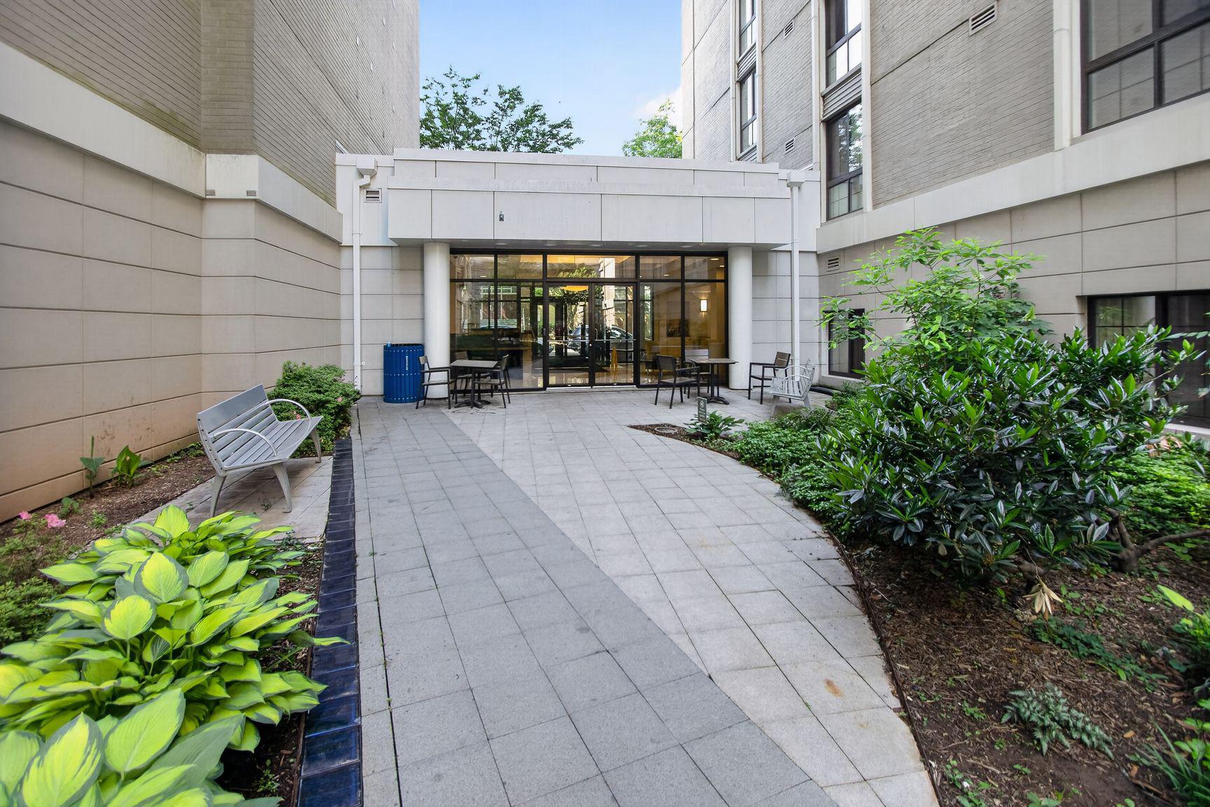 7915 Eastern Avenue Northwest, Unit 1011 Silver Spring, MD 20910 - Photo 20 of 28 a front view of a house with garden
