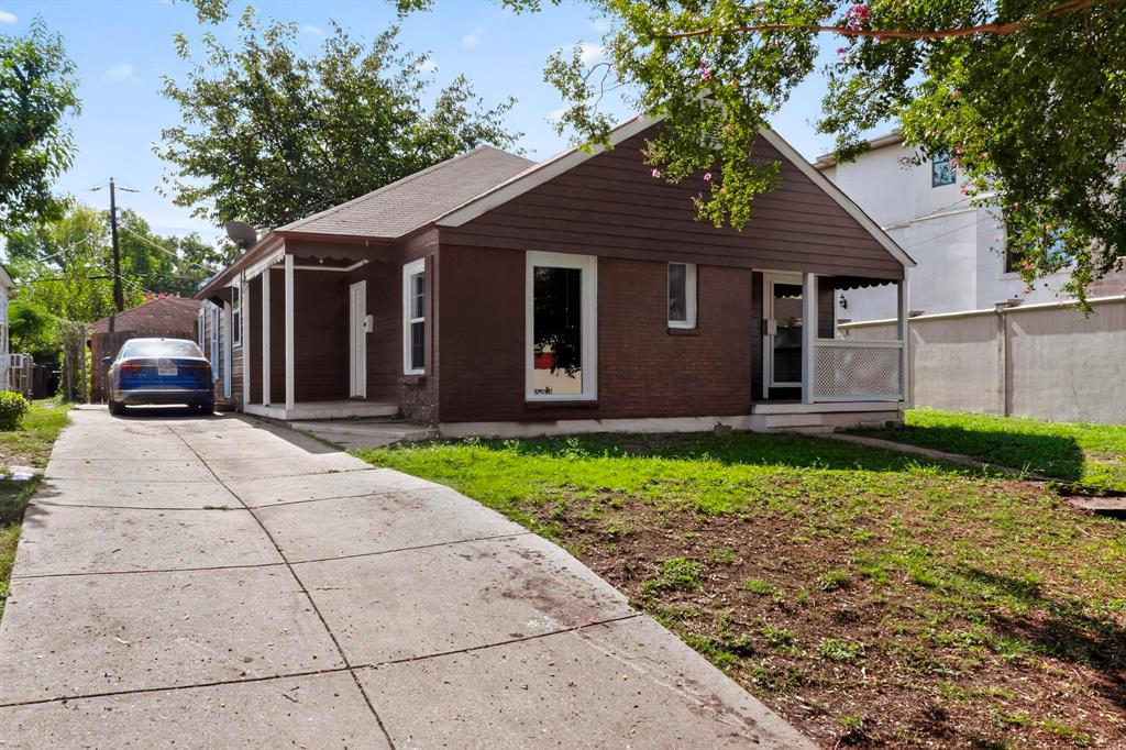 5020 Pershing Street Dallas, TX 75206 - Photo 23 of 30 a front view of a house with a garden