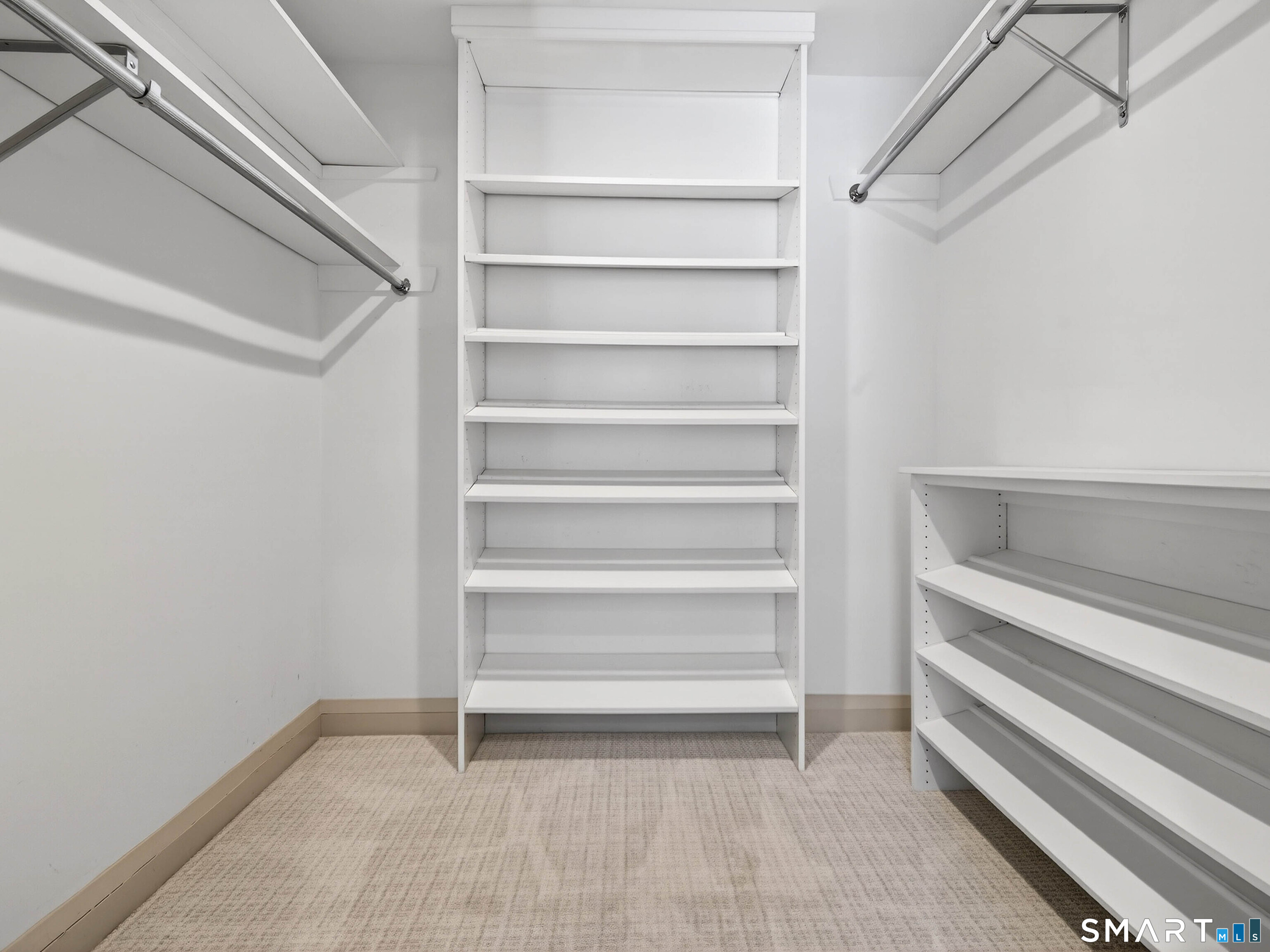 34-1 Johnny Cake Hill Road Old Lyme, CT 06371 - Photo 14 of 40 a view of walk in closet with empty racks