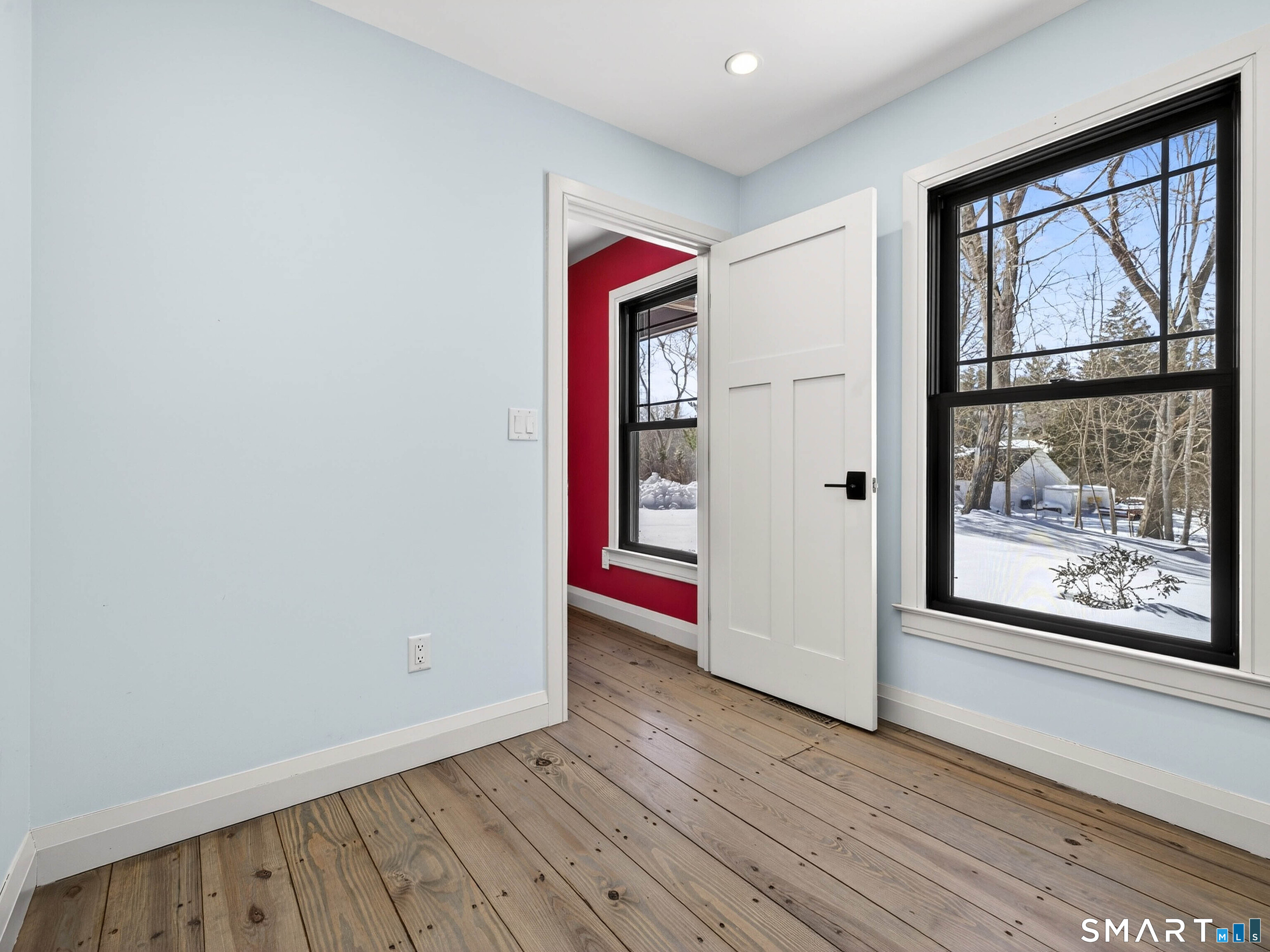 34-1 Johnny Cake Hill Road Old Lyme, CT 06371 - Photo 19 of 40 a view of an empty room with wooden floor and a window