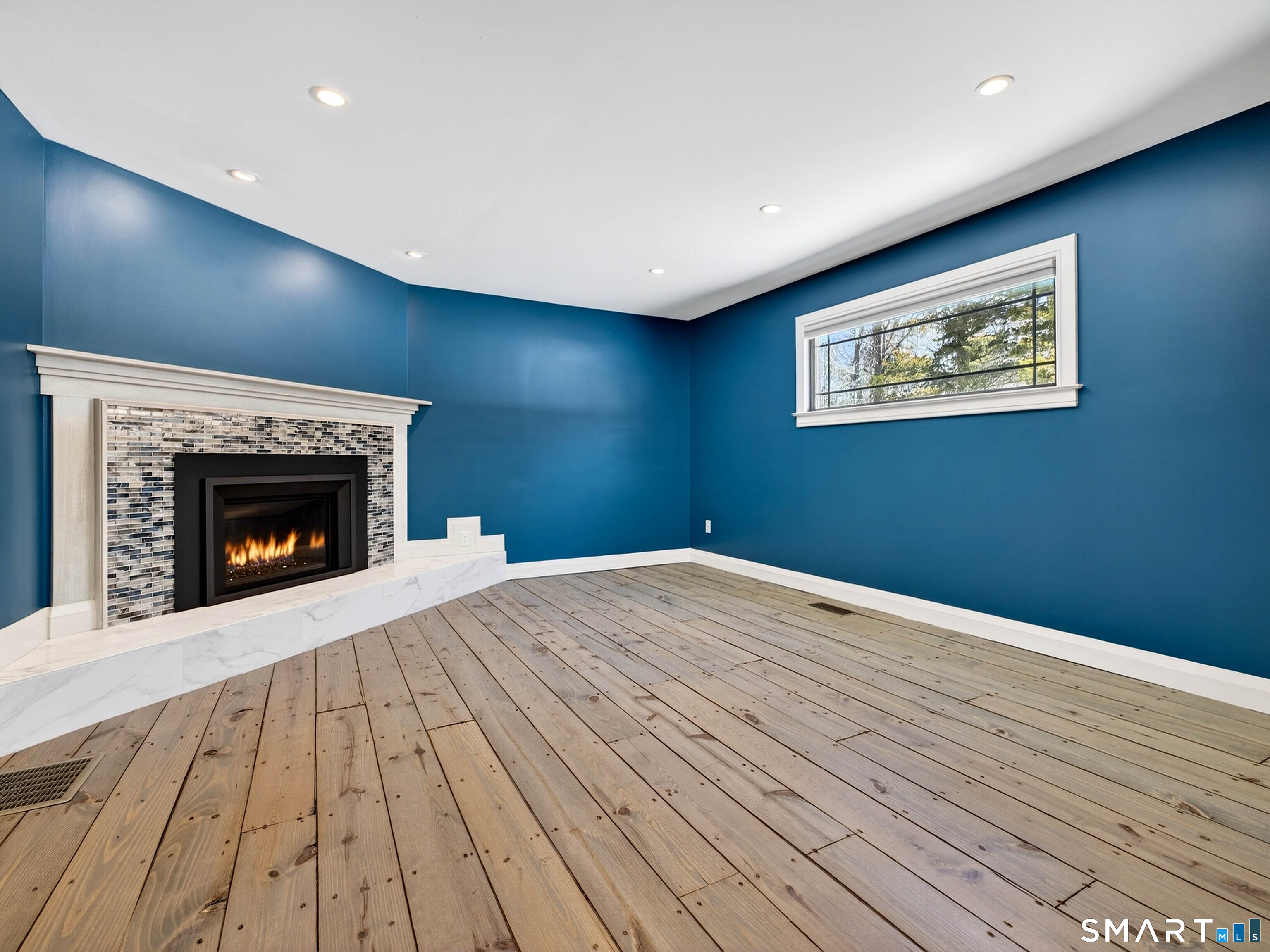 34-1 Johnny Cake Hill Road Old Lyme, CT 06371 - Photo 21 of 40 a view of empty room with wooden floor and fireplace