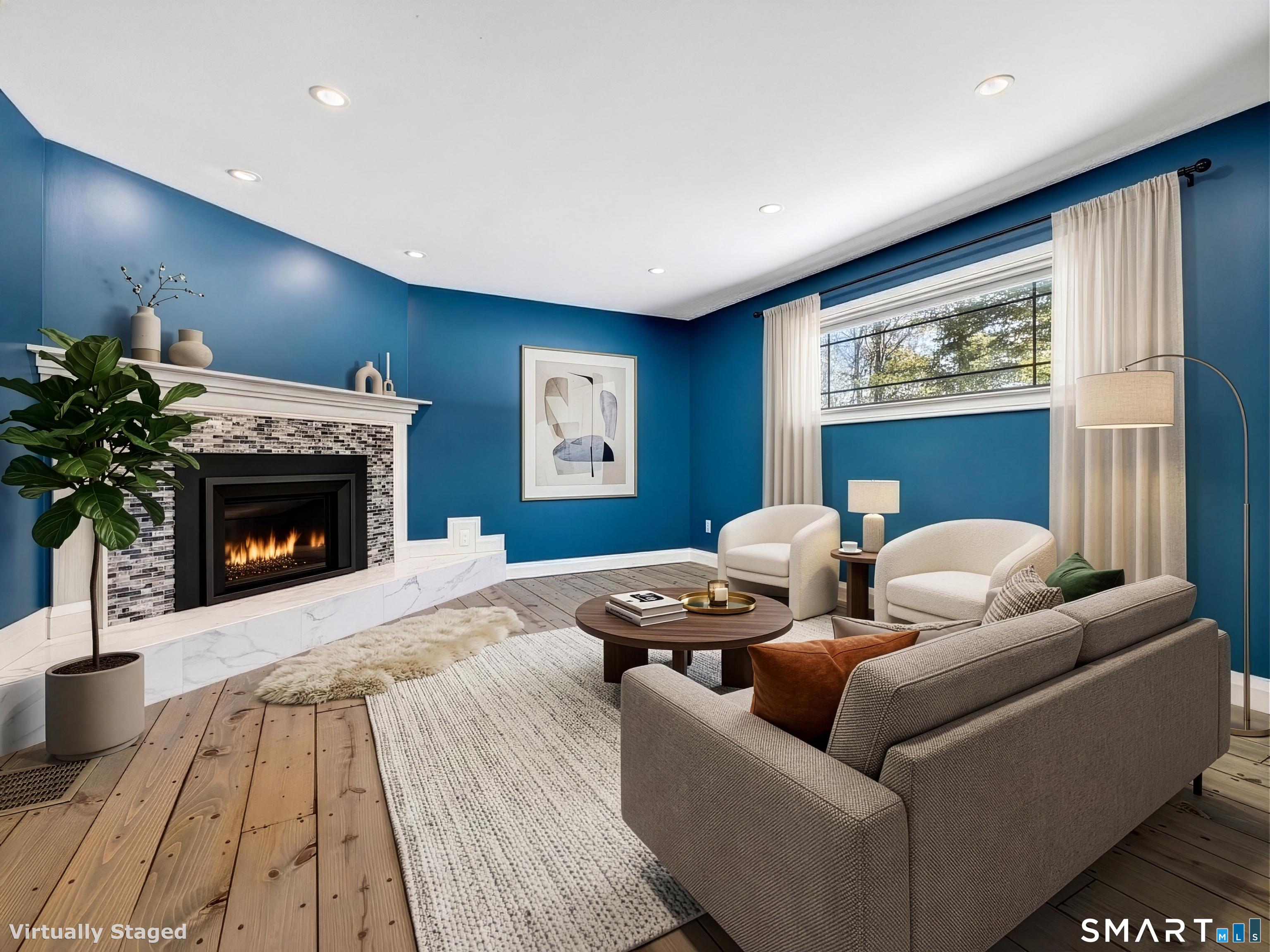 34-1 Johnny Cake Hill Road Old Lyme, CT 06371 - Photo 22 of 40 a living room with furniture and a fireplace