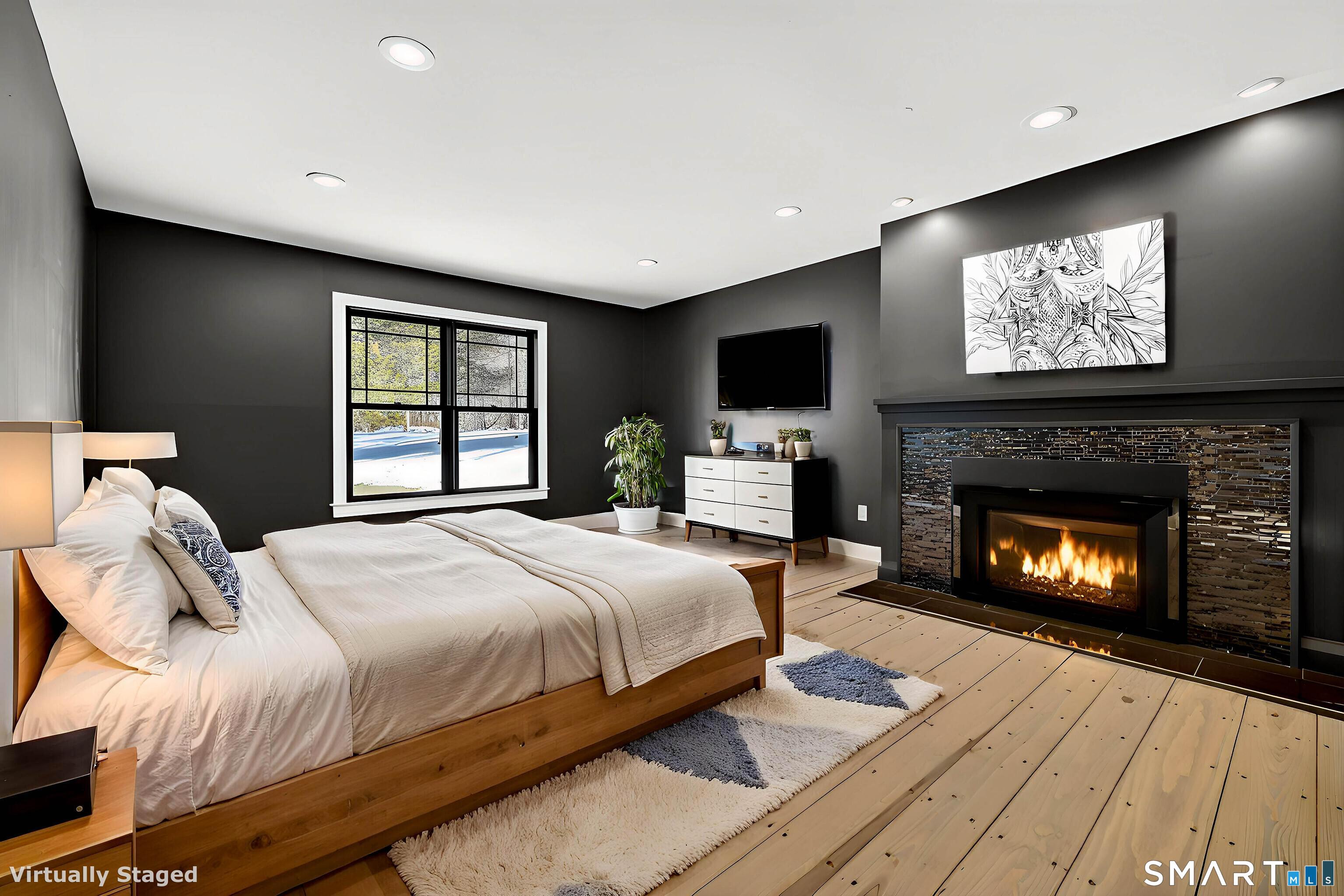 34-1 Johnny Cake Hill Road Old Lyme, CT 06371 - Photo 10 of 40 a bedroom with a bed and a fireplace