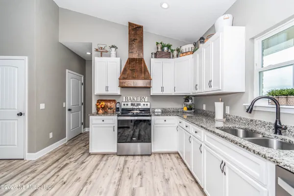 a kitchen with a stove and a refrigerator