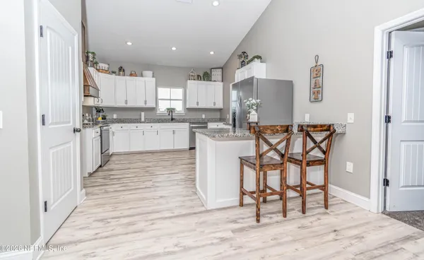 a living room with a furniture and a table