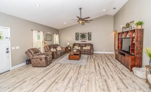 a living room with furniture and a window