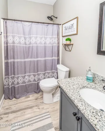 a bedroom with furniture a baby crib and a dresser