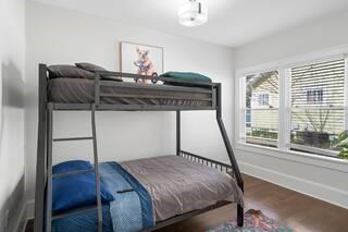 786 Peeples Street Southwest Atlanta, GA 30310 - Photo 14 of 14 a bedroom with a bed and wooden floor