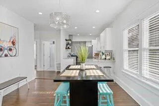 a view of kitchen with cabinets and window