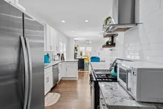 a kitchen with cabinets and stainless steel appliances