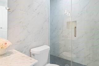 786 Peeples Street Southwest Atlanta, GA 30310 - Photo 10 of 14 a white toilet sitting next to a bathroom sink