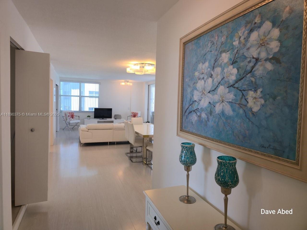 a living room with furniture and a mirror