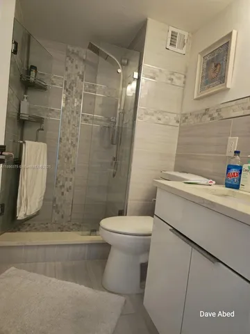 a bathroom with a sink and toilet
