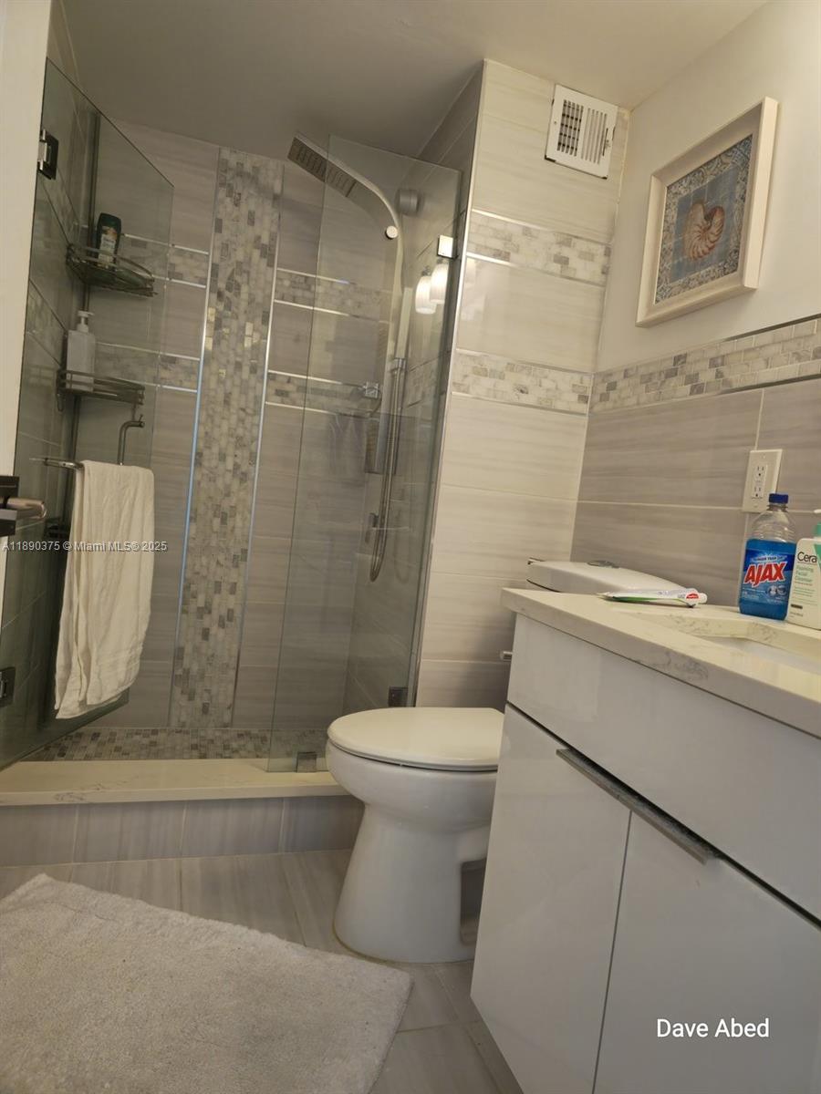 3600 Galt Ocean Drive, Unit 14C Fort Lauderdale, FL 33308 - Photo 14 of 22 a bathroom with a sink and toilet