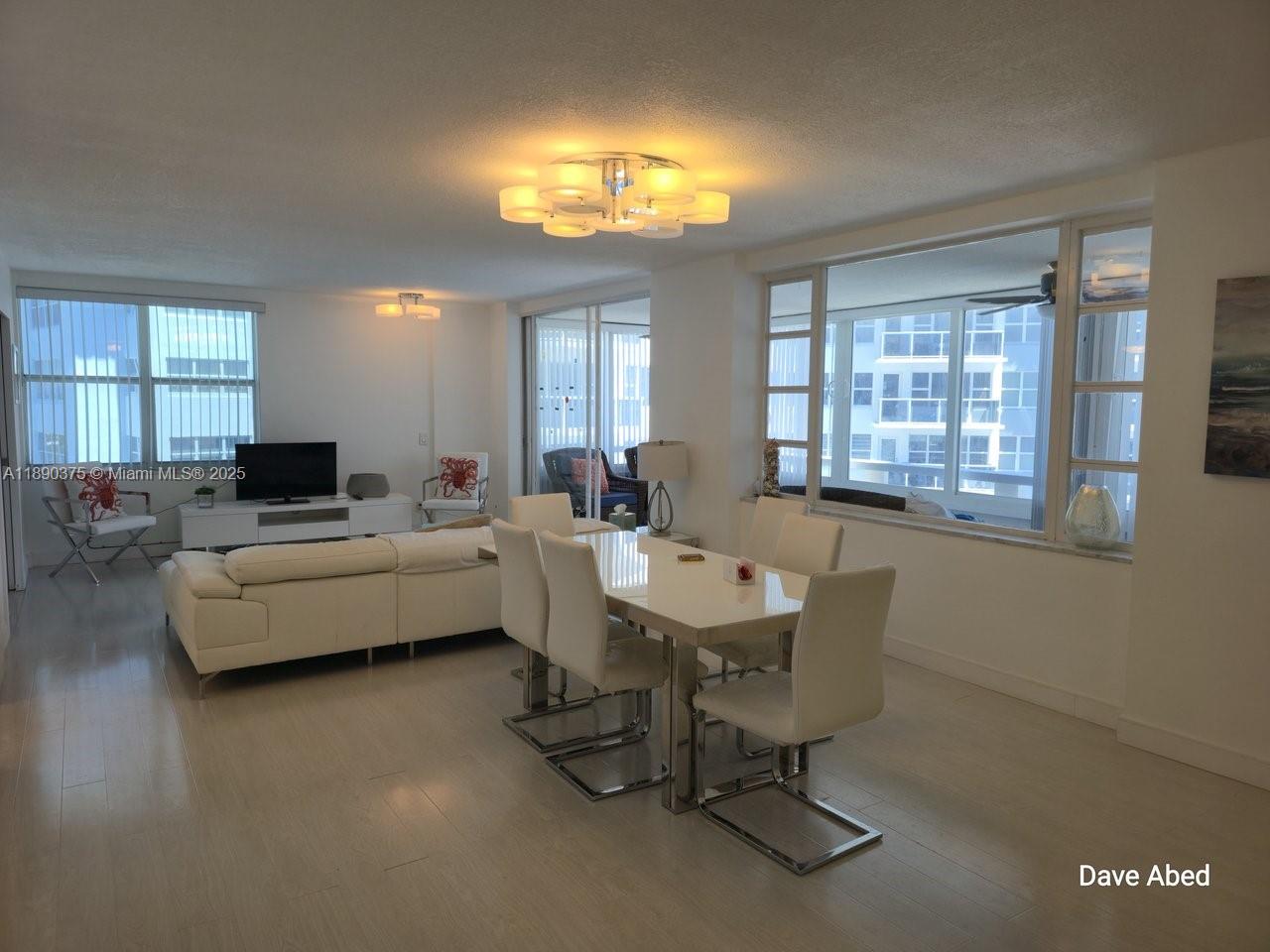 3600 Galt Ocean Drive, Unit 14C Fort Lauderdale, FL 33308 - Photo 6 of 22 a living room with furniture and a large window