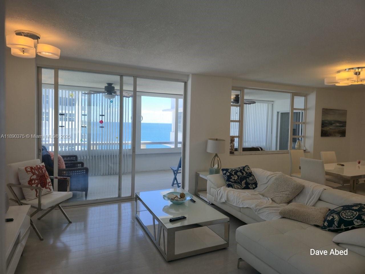 3600 Galt Ocean Drive, Unit 14C Fort Lauderdale, FL 33308 - Photo 7 of 22 a living room with furniture and a large window