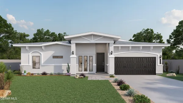 a front view of a house with a garden and yard