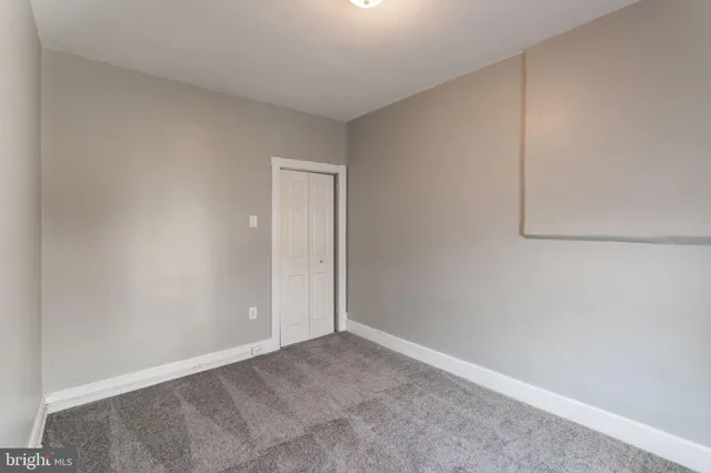 a view of an empty room and entryway