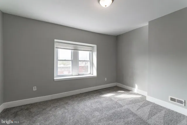 an empty room with a window