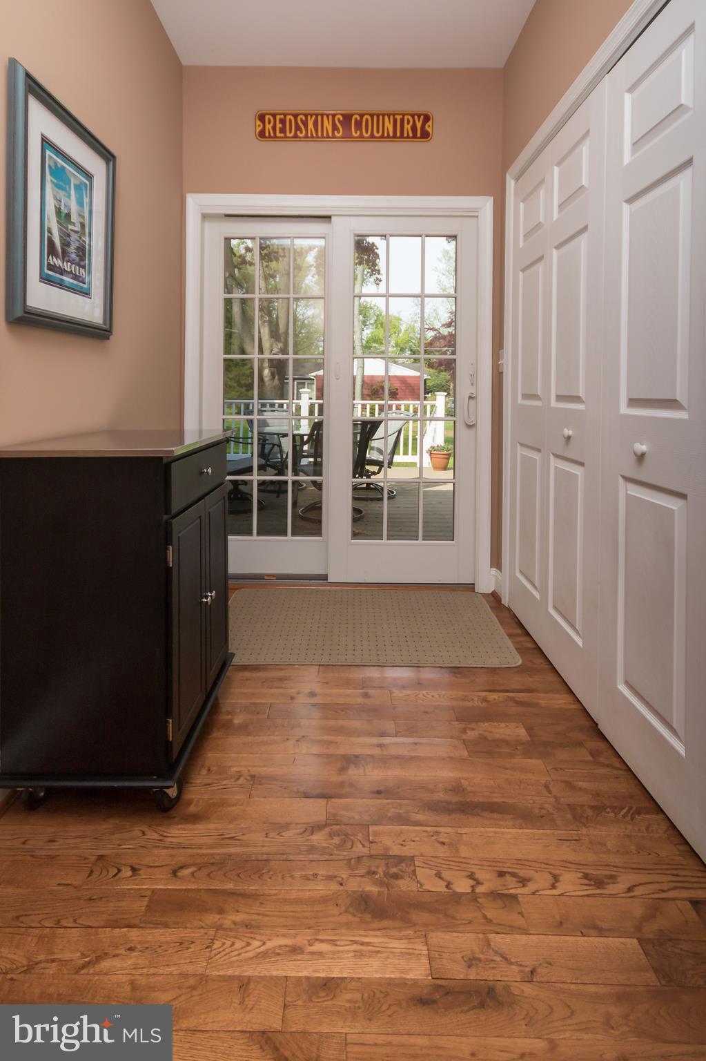 109 Severn Avenue Severna Park, MD 21146 - Photo 13 of 29 Large hallway to deck and washer and dryer