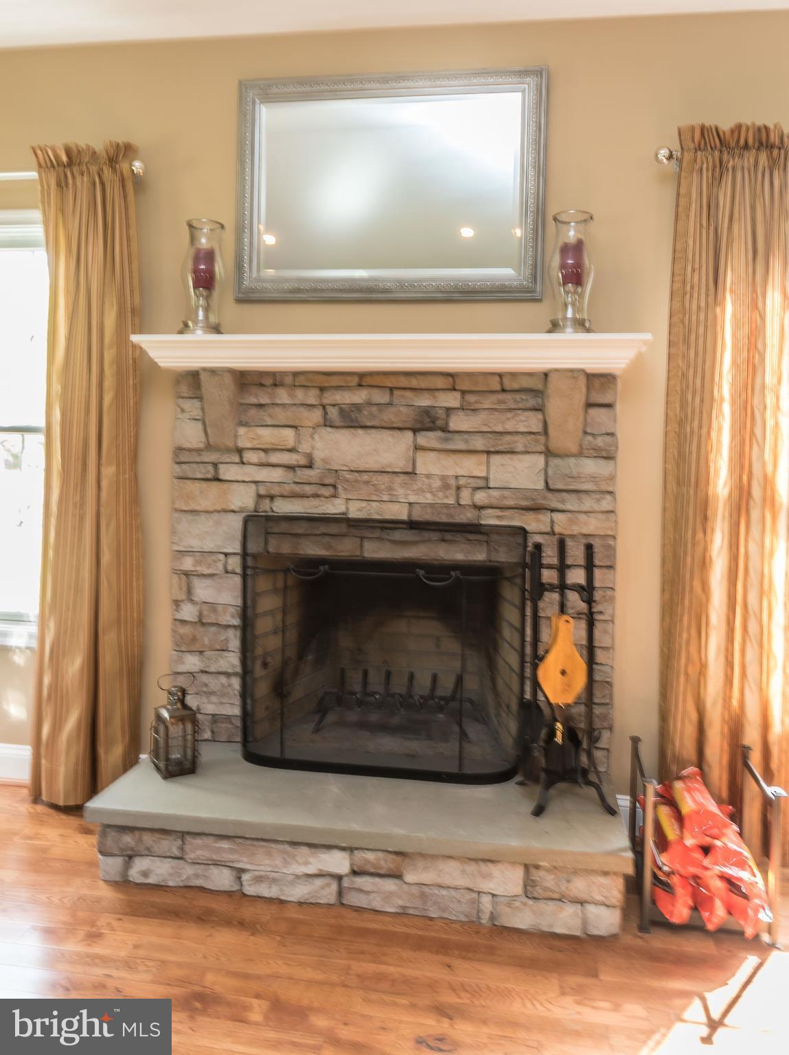 109 Severn Avenue Severna Park, MD 21146 - Photo 18 of 29 Stacked stone wood burning fireplace