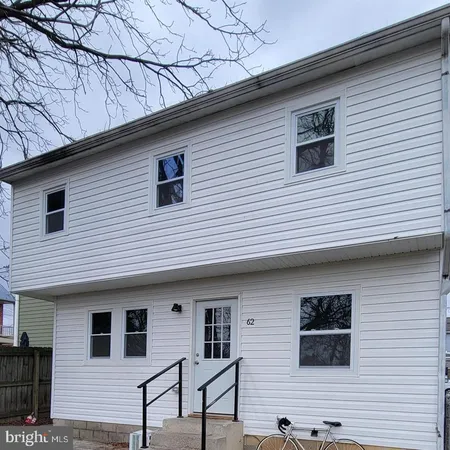 a view of a house and a yard