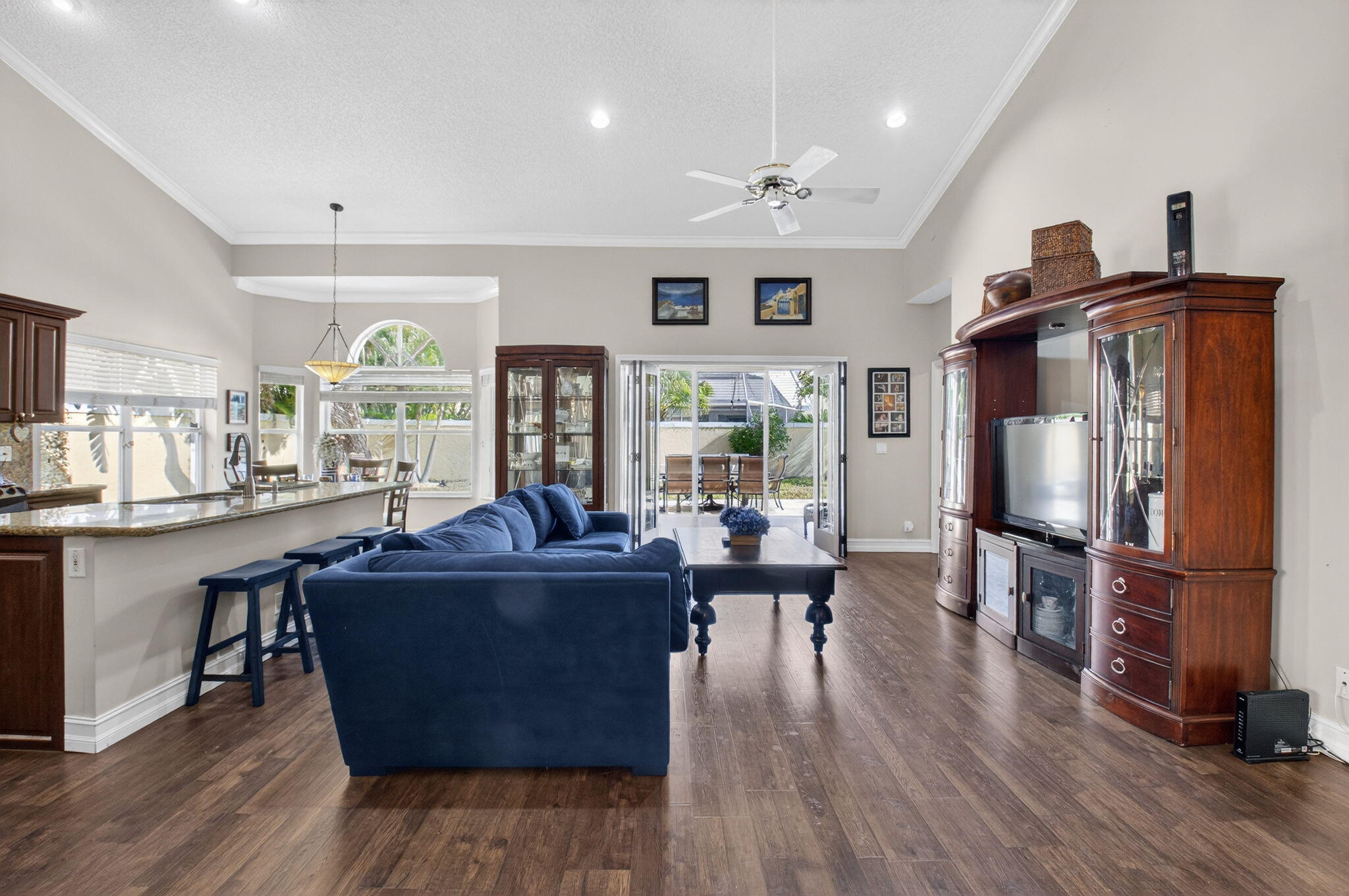 8361 Horseshoe Bay Road Boynton Beach, FL 33472 - Photo 12 of 73 a living room with furniture a wooden floor and a kitchen view