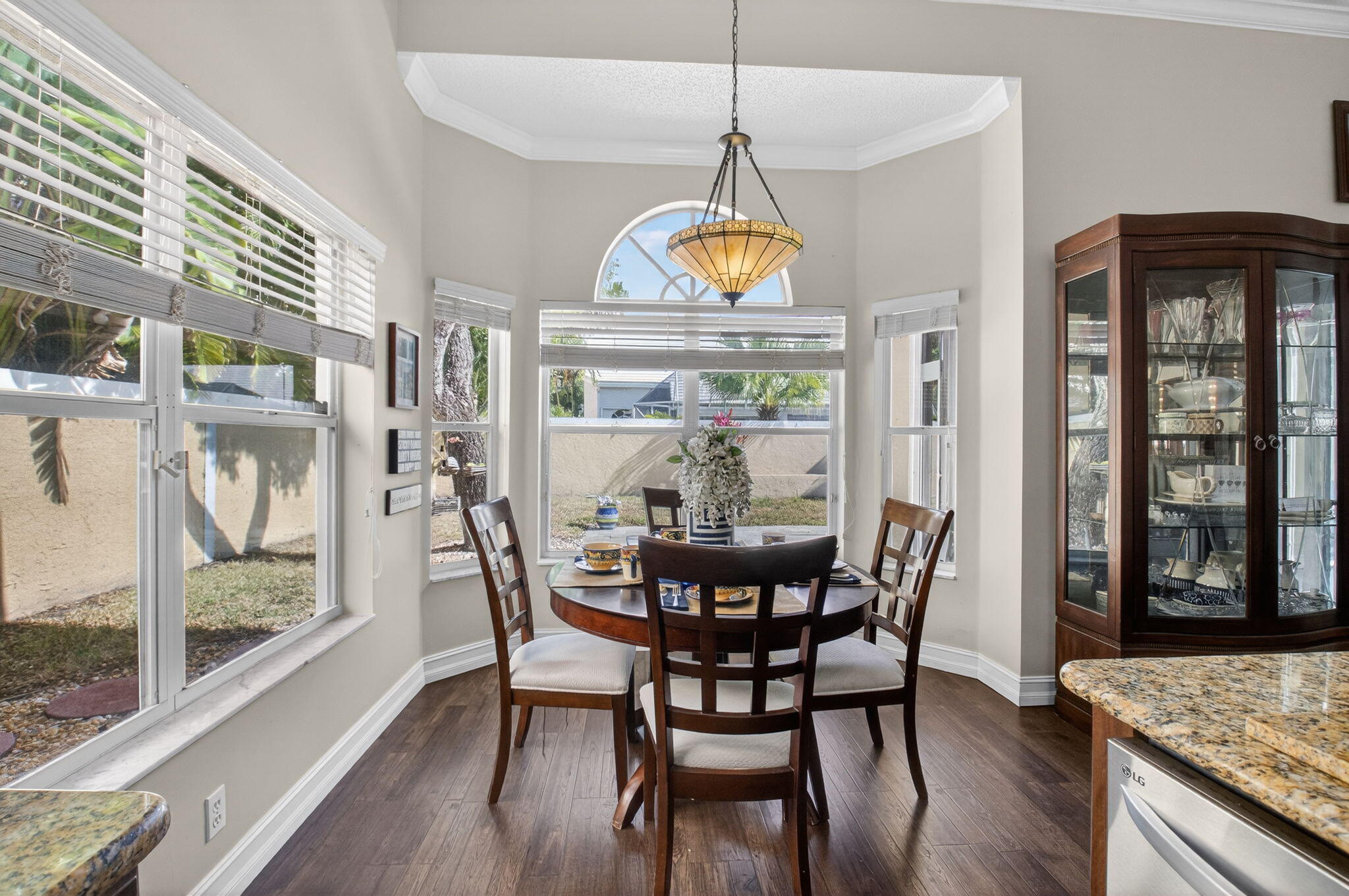 8361 Horseshoe Bay Road Boynton Beach, FL 33472 - Photo 23 of 73 a view of a dining room with furniture window and wooden floor