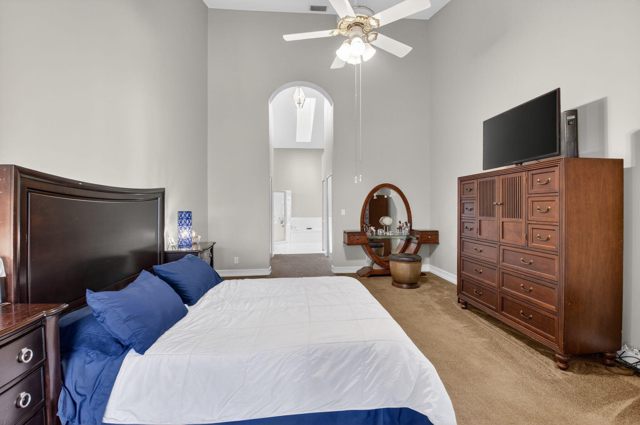 8361 Horseshoe Bay Road Boynton Beach, FL 33472 - Photo 26 of 73 a bedroom with bed tv and a mirror