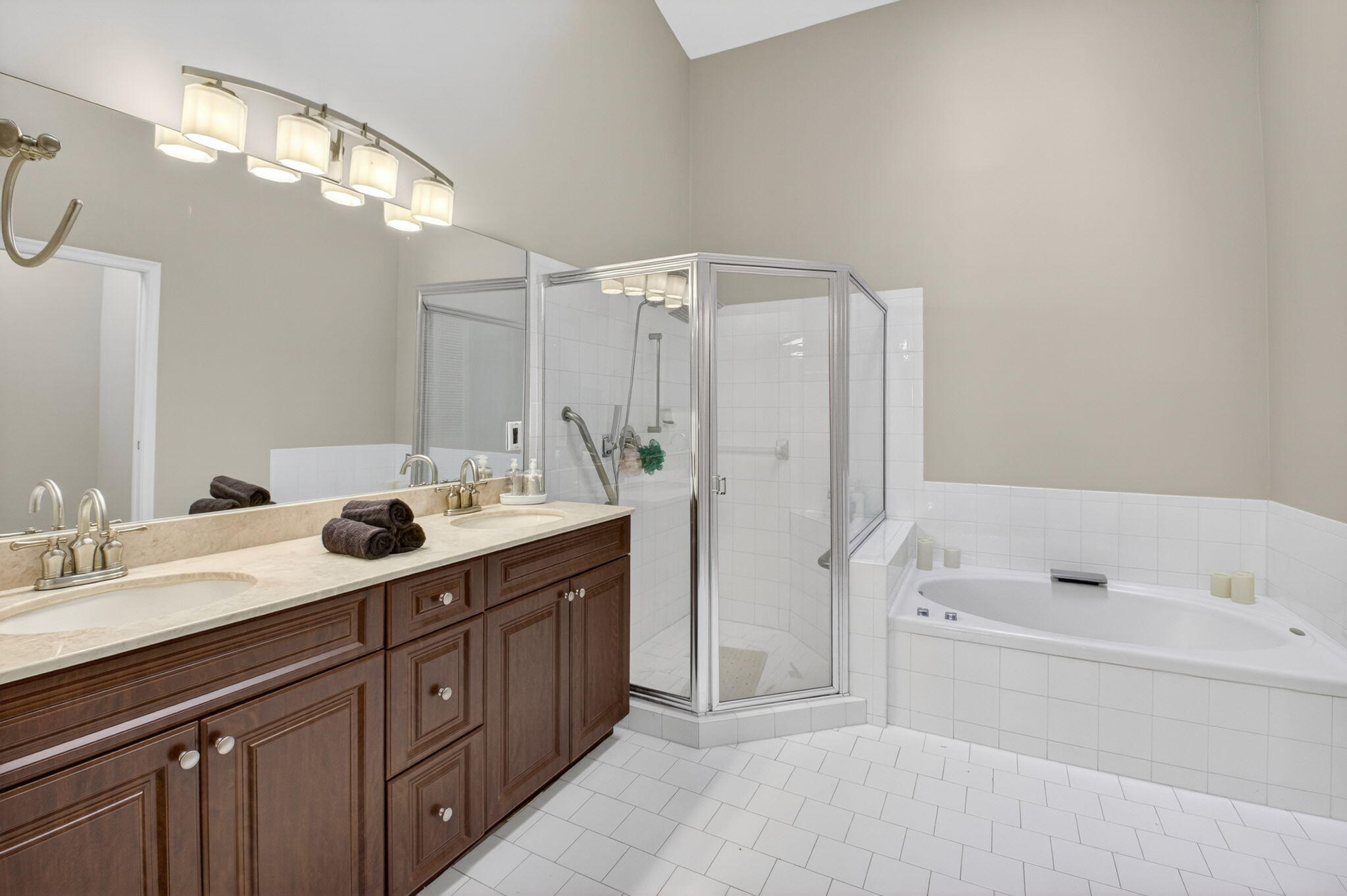 8361 Horseshoe Bay Road Boynton Beach, FL 33472 - Photo 28 of 73 a spacious bathroom with a tub sink double vanity and mirror