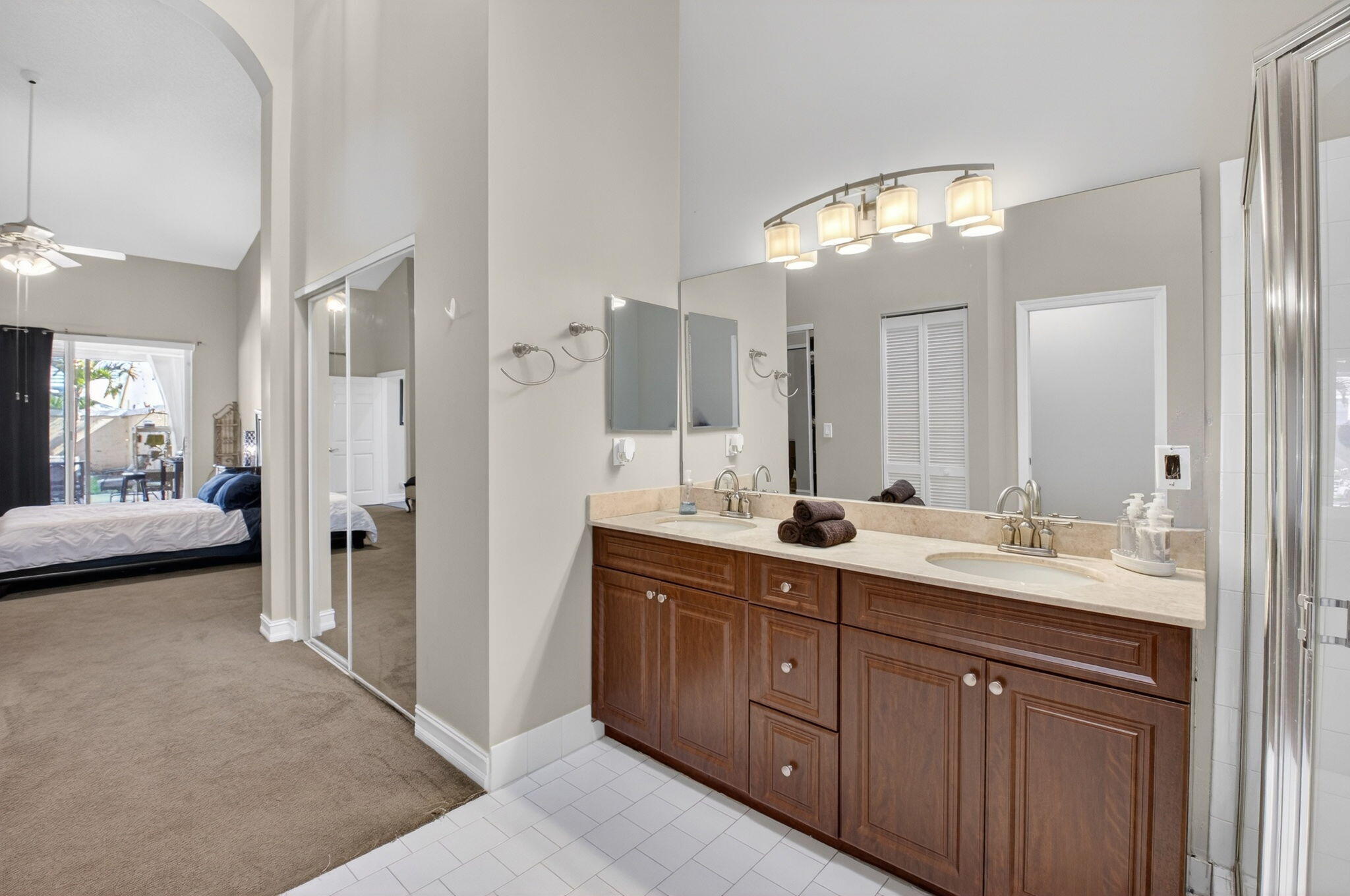 8361 Horseshoe Bay Road Boynton Beach, FL 33472 - Photo 30 of 73 a bathroom with a double vanity sink and a mirror