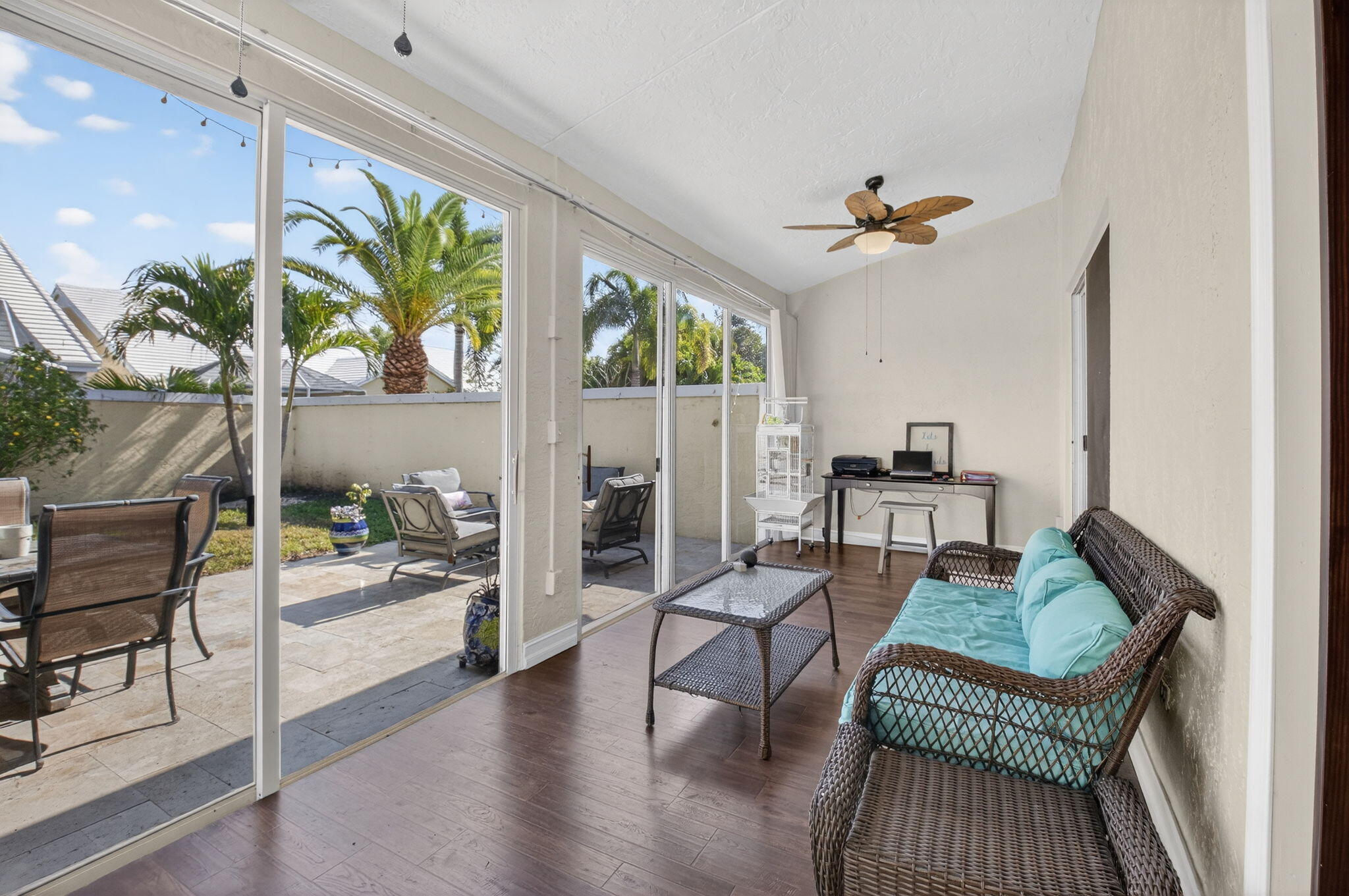 8361 Horseshoe Bay Road Boynton Beach, FL 33472 - Photo 32 of 73 a living room with furniture a fireplace and a chandelier