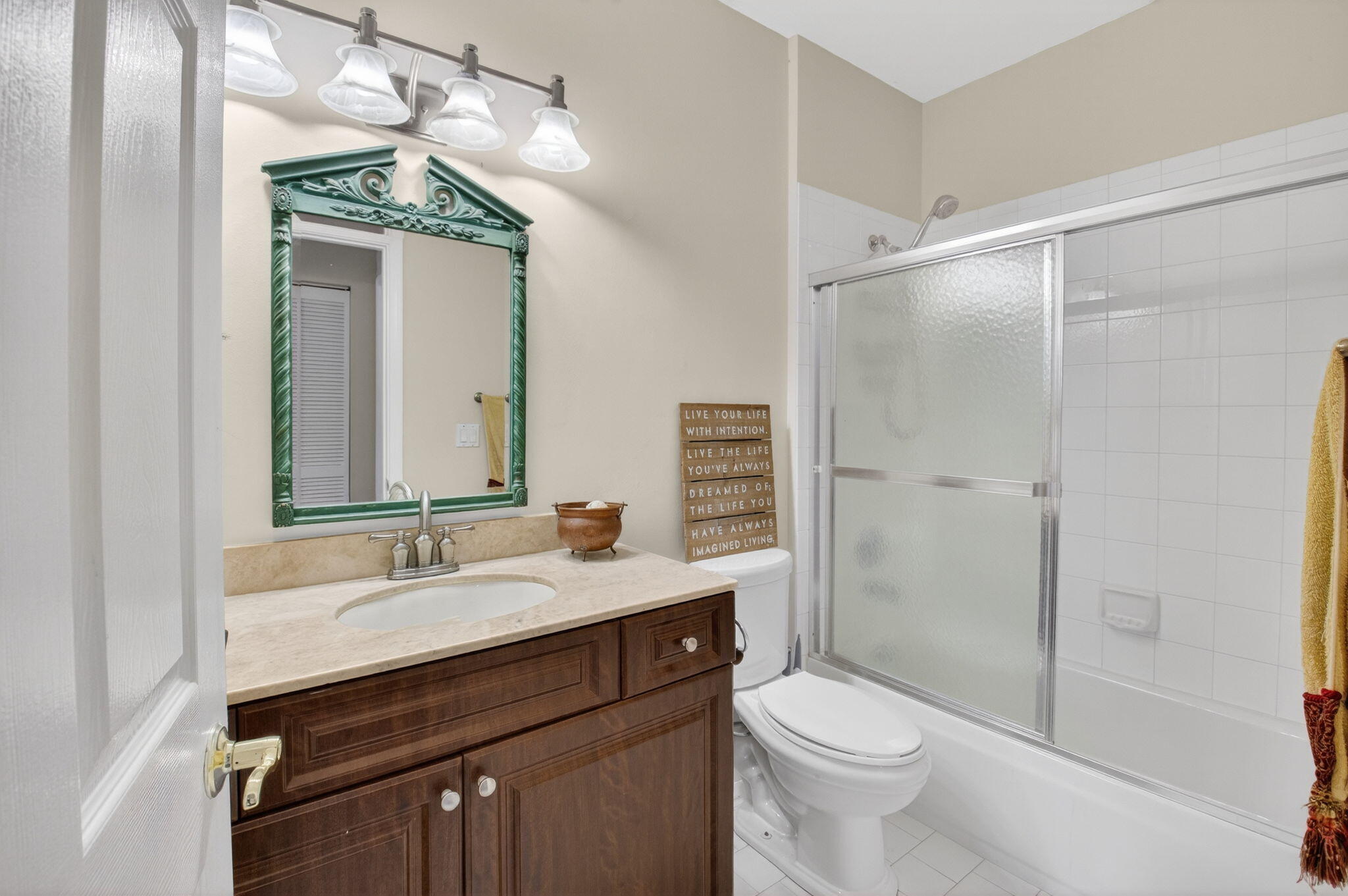 8361 Horseshoe Bay Road Boynton Beach, FL 33472 - Photo 37 of 73 a bathroom with a sink a toilet a mirror and shower