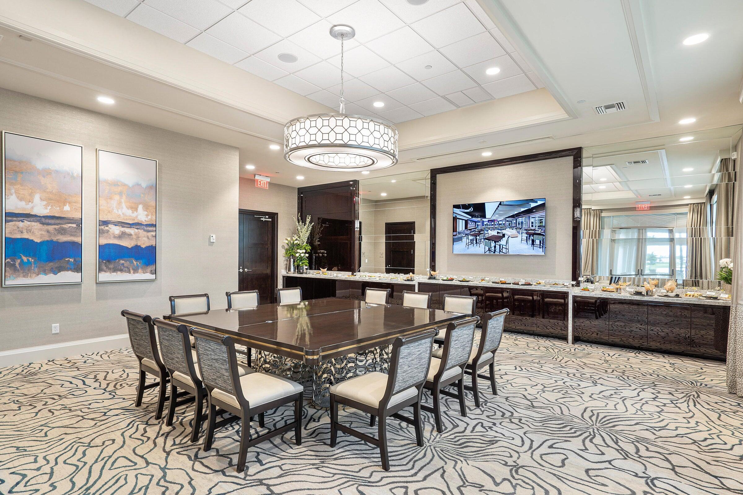 8361 Horseshoe Bay Road Boynton Beach, FL 33472 - Photo 72 of 73 a view of a dining room with furniture wooden floor and chandelier