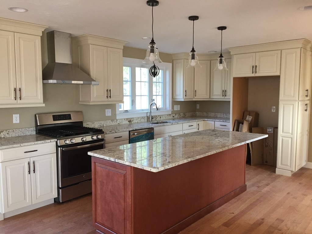 6 Quail Ridge Road Merrimac, MA 01860 - Photo 2 of 10 a kitchen with stainless steel appliances granite countertop a sink a stove a refrigerator a center island and cabinets