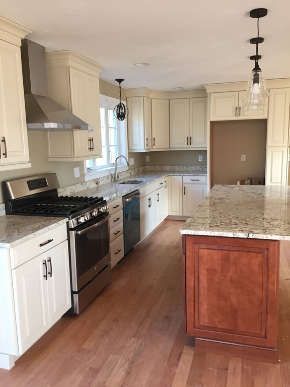 6 Quail Ridge Road Merrimac, MA 01860 - Photo 3 of 10 a kitchen with granite countertop stainless steel appliances and wooden cabinets