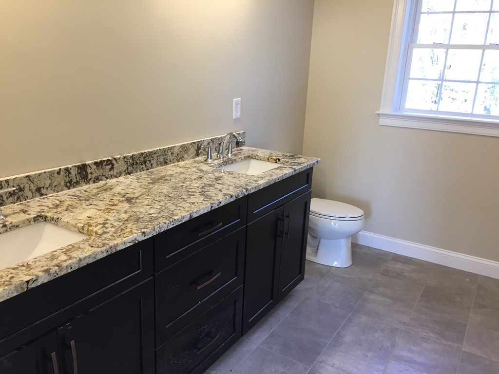 6 Quail Ridge Road Merrimac, MA 01860 - Photo 5 of 10 a bathroom with a granite countertop sink and a toilet