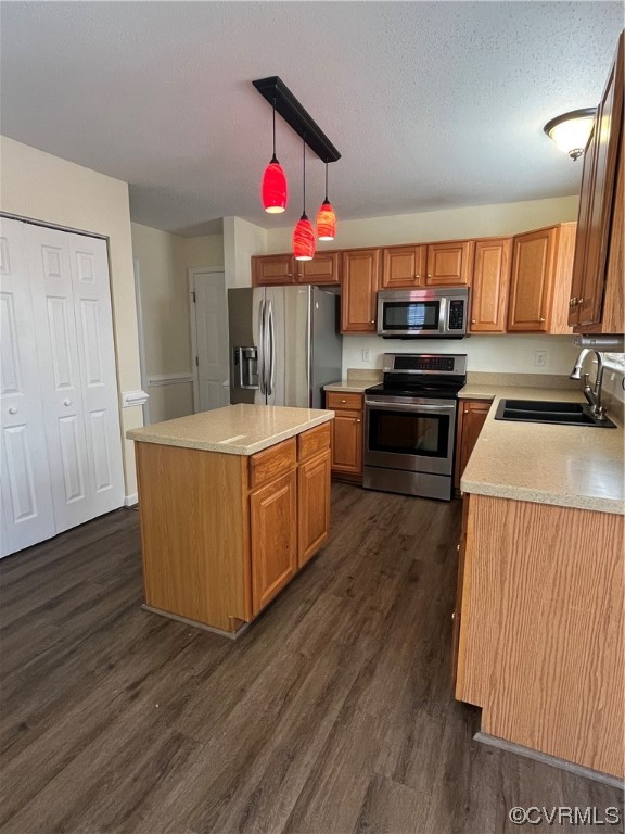 1023 Bogart Road Richmond, VA 23223 - Photo 11 of 40 a kitchen that has a lot of cabinets and wooden floor