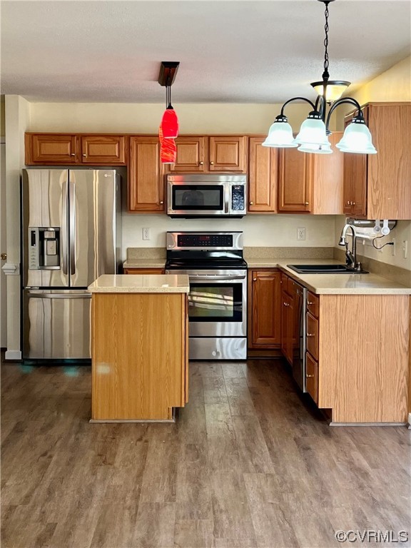 1023 Bogart Road Richmond, VA 23223 - Photo 12 of 40 a kitchen with stainless steel appliances granite countertop a stove a sink and a refrigerator