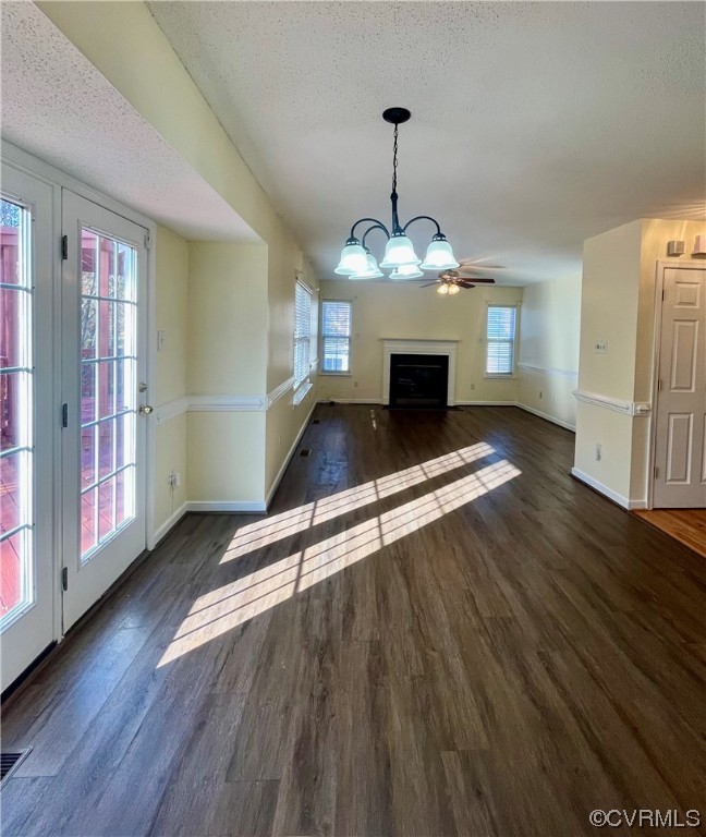 1023 Bogart Road Richmond, VA 23223 - Photo 14 of 40 a view of a livingroom with wooden floor staircase and kitchen view