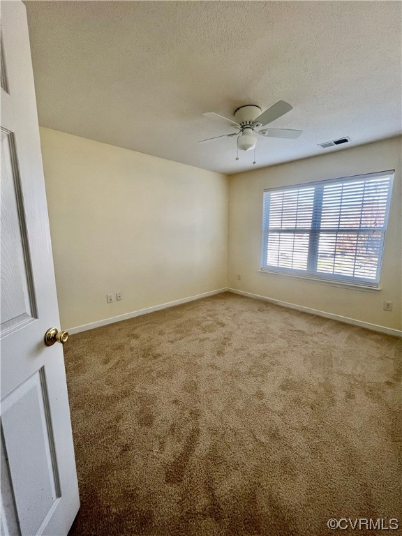 1023 Bogart Road Richmond, VA 23223 - Photo 21 of 40 an empty room with windows and ceiling fan