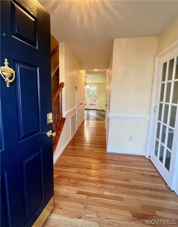 1023 Bogart Road Richmond, VA 23223 - Photo 3 of 40 a view of a hallway with wooden floor and staircase