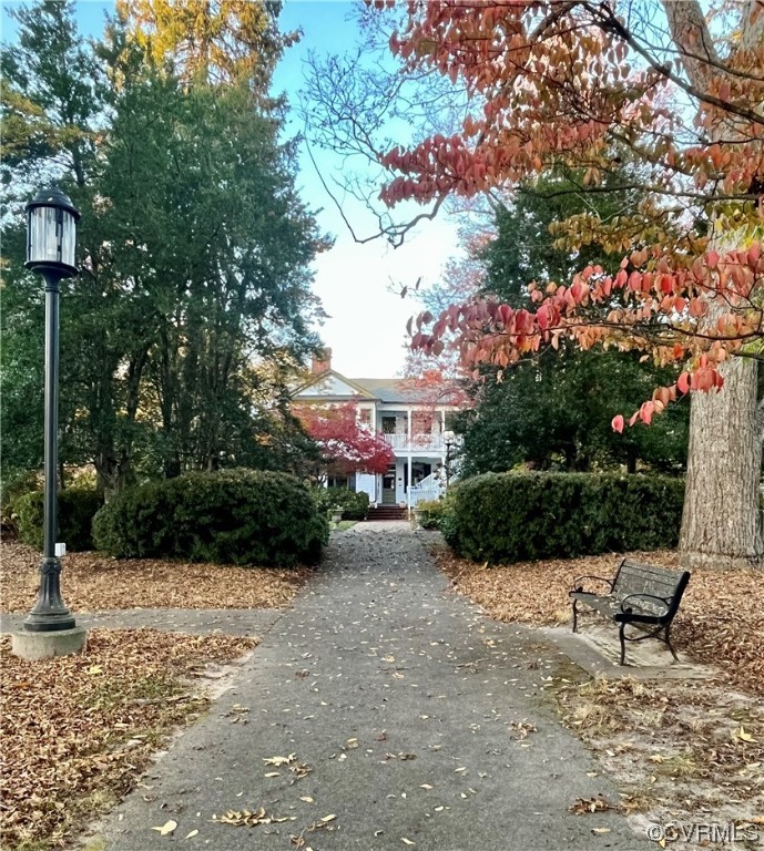 1023 Bogart Road Richmond, VA 23223 - Photo 36 of 40 a view of a street with potted plants and large trees
