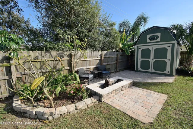 a wooden bench sitting in front of a house