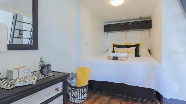 a room with chair and wooden floor