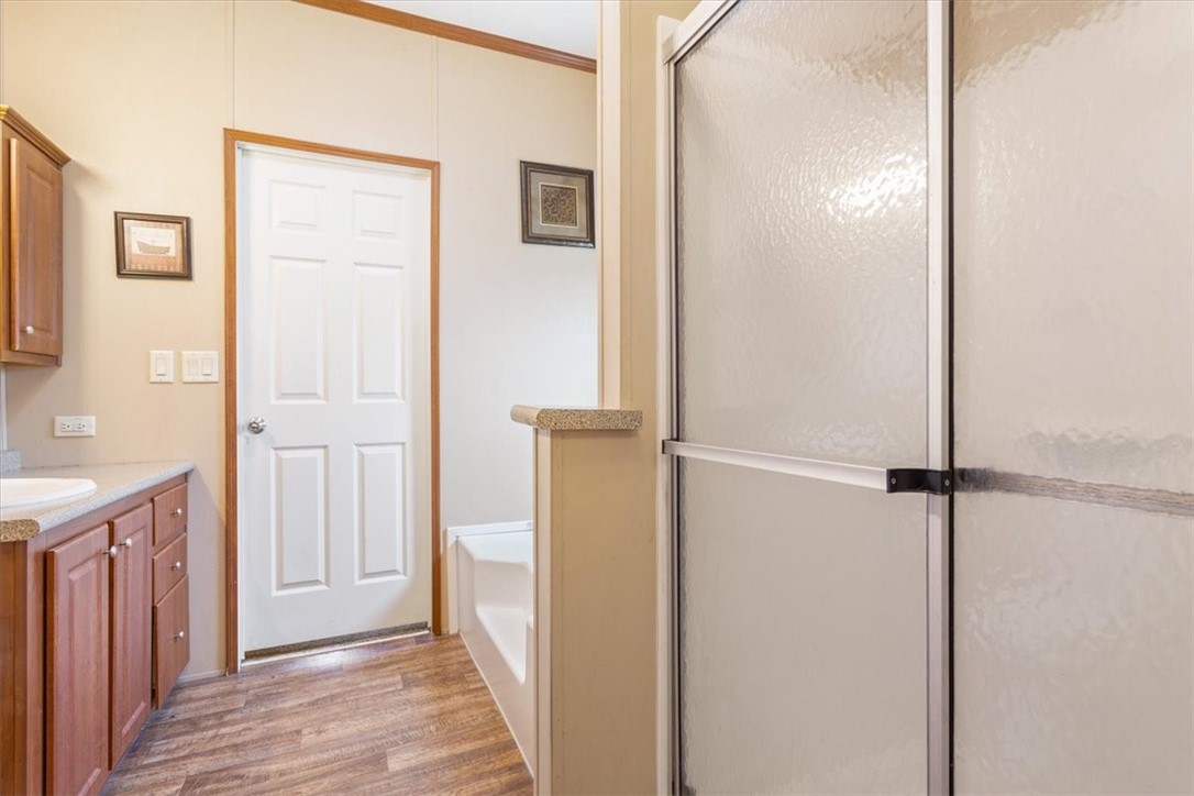 4517 Rocking K Drive Waco, TX 76705 - Photo 16 of 25 a view of a hallway with closet and wooden floor