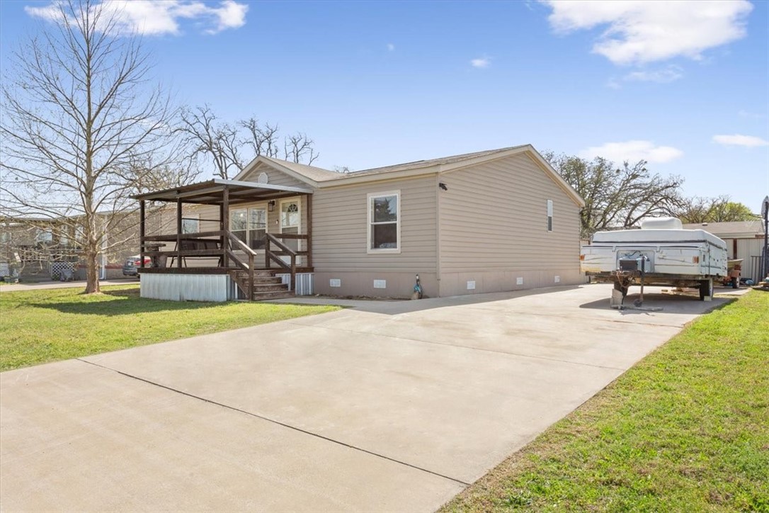 4517 Rocking K Drive Waco, TX 76705 - Photo 2 of 25 a front view of a house with a yard and garage