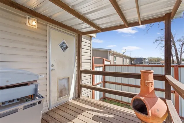 a view of a balcony with furniture
