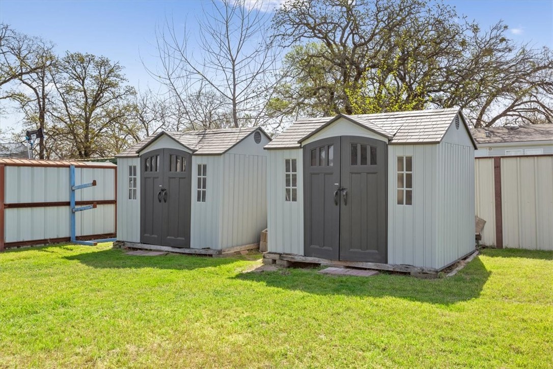 4517 Rocking K Drive Waco, TX 76705 - Photo 22 of 25 a front view of house with yard and trees in the background