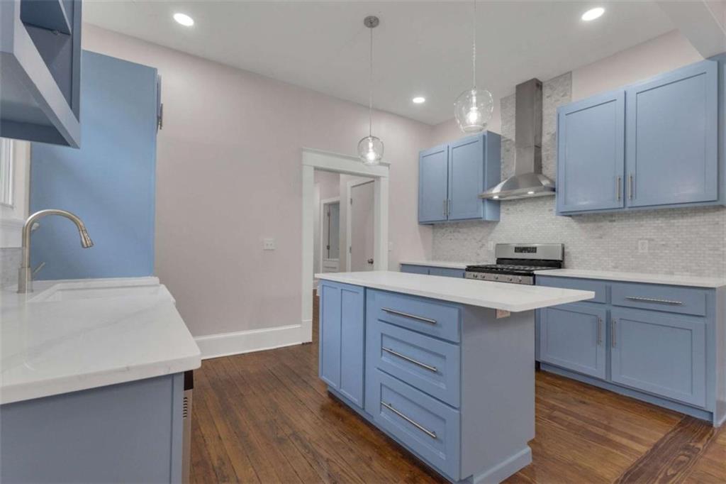 1286 Allene Avenue Southwest Atlanta, GA 30310 - Photo 19 of 49 a kitchen with wooden cabinets and a sink